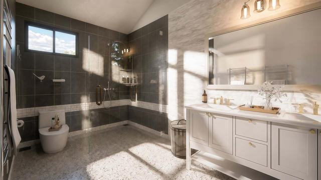 Bathroom view of the 1,235-square-foot upper one-bedroom casita over a multi-garage composition, showing double vanity and glass shower.