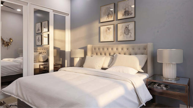 Bedroom view of the 450-square-foot, 15-by-30-foot attached one-bedroom casita, showing bedroom and mirrored closet.