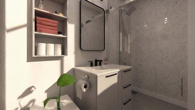 Bathroom view of the 288-square-foot, 16-by-18-foot attached studio casita with breezeway, showing shower and floating vanity.