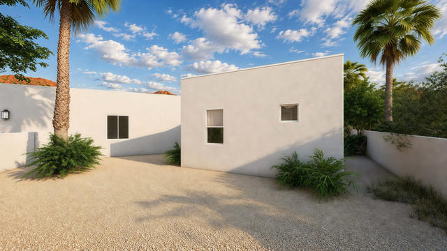 Studio Side view of the 300-square-foot, 20-by-15-foot gym and office casita, showing flat-roofed side approach.