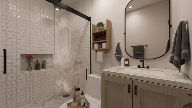 Bathroom view of the 360-square-foot, 21-by-12-foot attached casita, showing the tiled shower and vanity.
