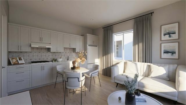 Kitchen and sofa rendering for the 400 square foot one-bedroom casita plan