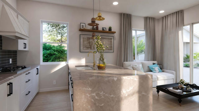 Kitchen view of the 500-square-foot, 25-by-20-foot one-bedroom casita, showing the cabinet wall and work surfaces.