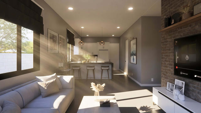 Interior rendering of the casita living room showing the media wall, open kitchen, seating, and natural window light