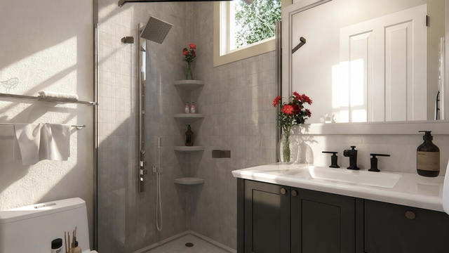 Compact casita bathroom with glass shower and dark floating vanity
