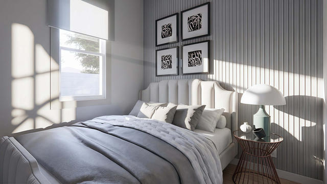 Bedroom view of the 405-square-foot, 27-by-15-foot one-bedroom casita, showing the private sleeping area and window wall.