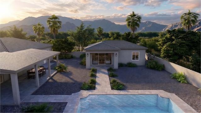 Aerial sunset exterior rendering of the 29 by 34 ADU near a pool and main home