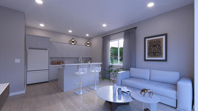 Living Room view of the 600-square-foot, 30-by-20-foot one-bedroom casita with laundry, showing the open seating and dining zone.