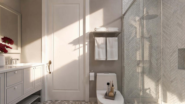 Interior rendering of the full bathroom showing a glass shower, vanity, toilet, and light wall tile