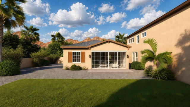 Rear exterior rendering of the studio casita showing a broad glazed opening, gable roof, lawn, and neighboring structure