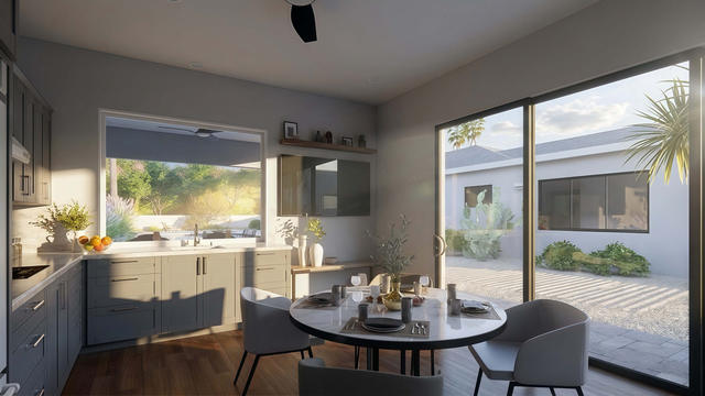 Living Room view of the 510-square-foot, 34-by-15-foot casita with covered patio, showing the open seating area and patio connection.