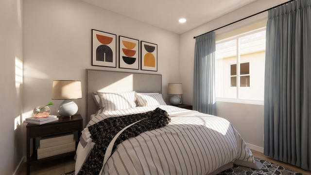 Bedroom view of the 1,200-square-foot three-bedroom casita with a 34-by-37-foot-6-inch overall extent, showing bright secondary bedroom.