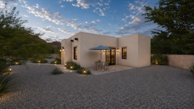Exterior rendering of the casita showing the side patio, glazed doors, windows, low parapets, and gravel yard