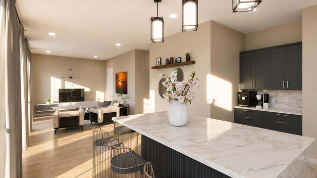Interior rendering of the open living and kitchen area showing island seating, dark cabinetry, lounge seating, and windows
