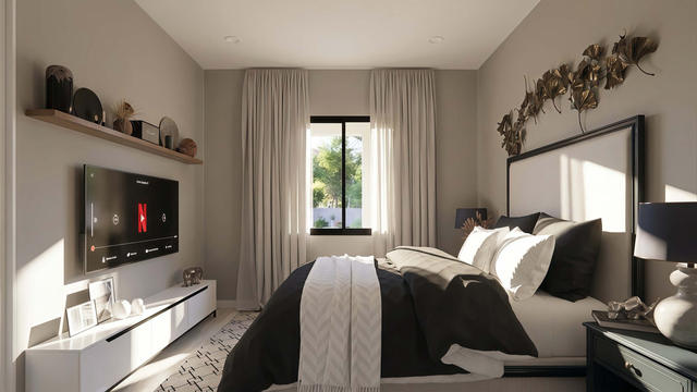 Interior rendering of the bedroom showing a bed, media cabinet, window, and neutral finishes