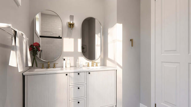 Bath Vanity view of the 1,104-square-foot, 70-by-34-foot two-bedroom casita with garage, showing bright double vanity.