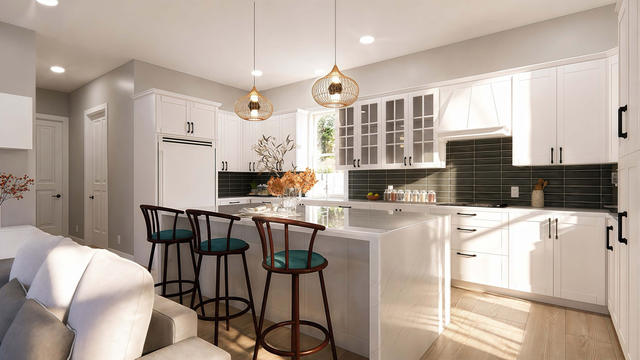 Kitchen view of the 1,104-square-foot, 70-by-34-foot two-bedroom casita with garage, showing island kitchen and cabinetry.