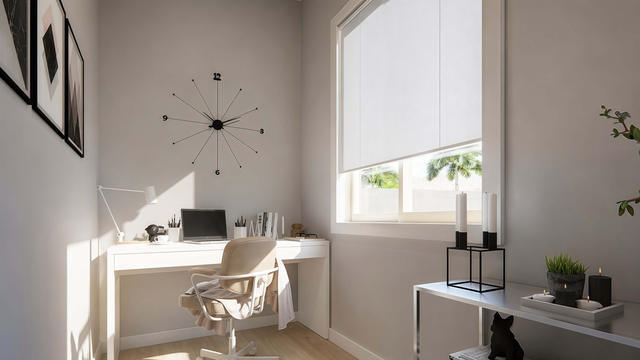 Office view of the 1,104-square-foot, 70-by-34-foot two-bedroom casita with garage, showing window-facing desk area.