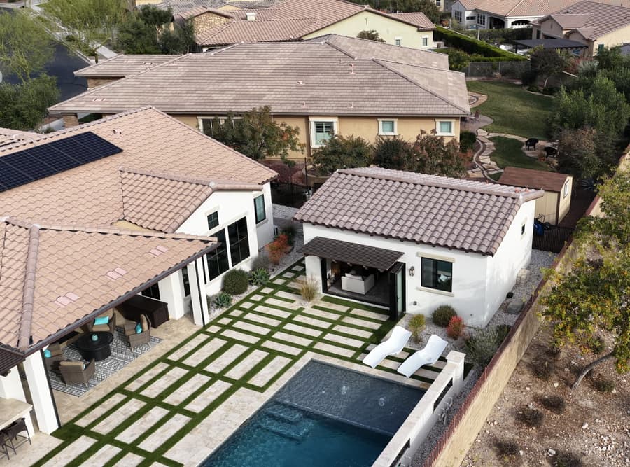 Aerial view of the Buckeye studio casita placed between the existing home, pool, and desert landscaping