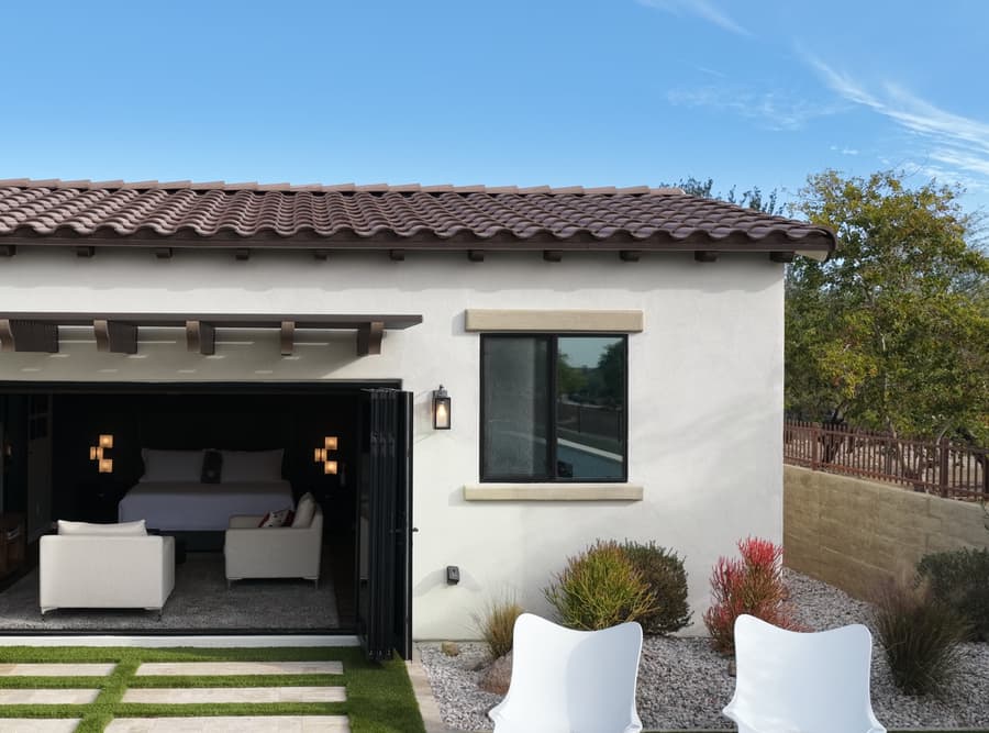 Buckeye studio casita front patio with paver walkway, dark shade canopy, and open studio entry