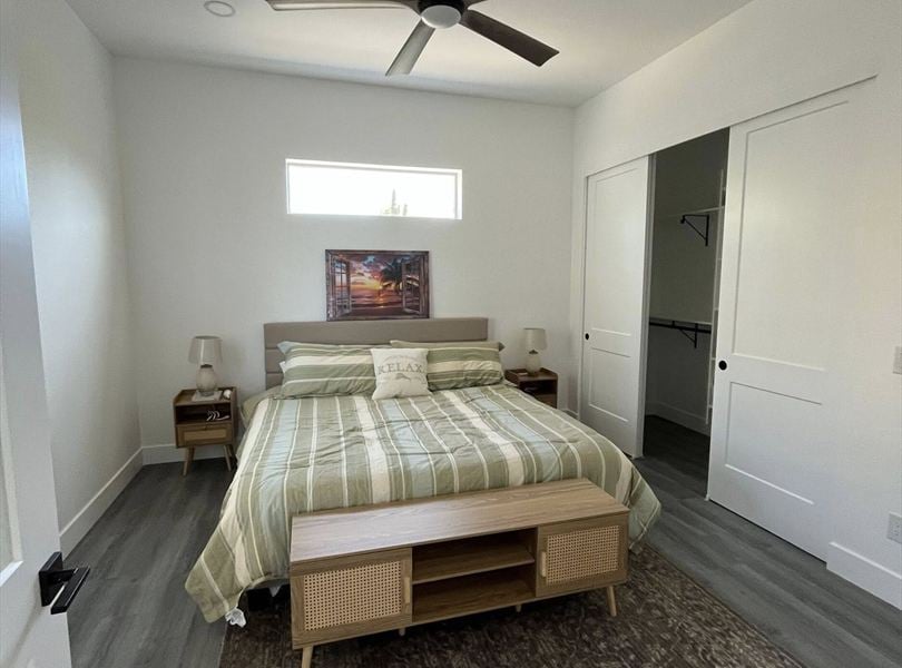 Cave Creek casita ADU bedroom with green bedding, closet, and 10 foot ceiling