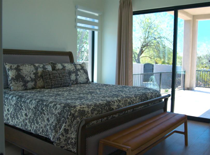 Finished casita bedroom with sliding glass door to patio